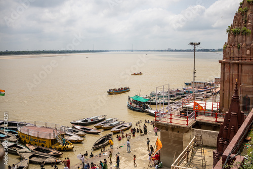 View of the river Ganges with its boats, people and sacred water of Varanasi in India
