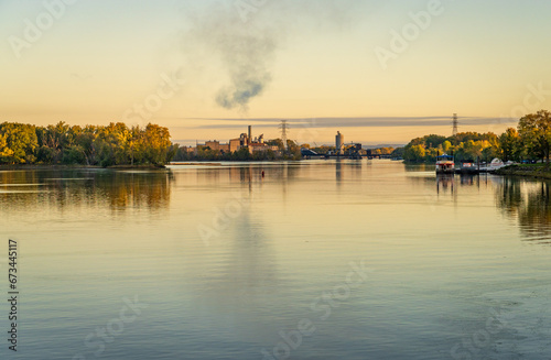 Steam rising above French Island power generating station by Mississippi river in La Crosse Wisconsin