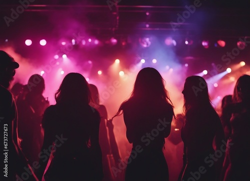 silhouettes of people dancing at a crowded party at midnight, colorful lights and smoke at background