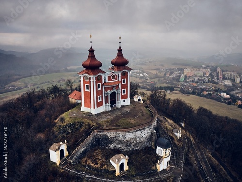 Aerial view of historical church atop on hill. Late baroque calvary in Banska Stiavnica in Slovakia.