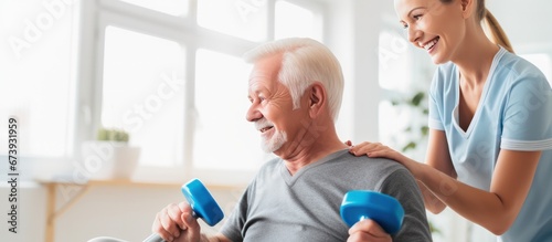 Physical therapist helpful senior patients to exercise