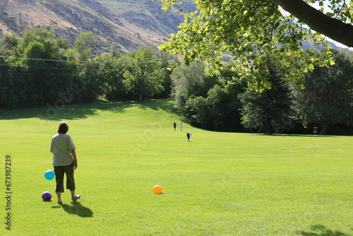 a family playing at the park in provo 