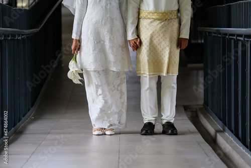 couple of wedding together with closeup on hand.