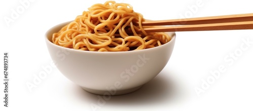 Mie Goreng Jawa or bakmi jawa or java noodle with spoon and fork. Indonesian traditional street food noodles from central java or Yogyakarta, indonesia on rustic wooden table background.
