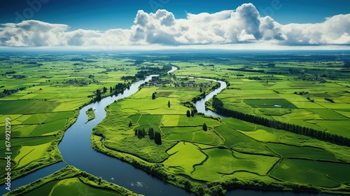 Aerial drone view of typical Dutch landscape with canals, polder water, green fields and farm houses from above, Holland, Netherlands