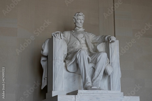 Majestic stone statue of a figure resembling 16th President of the United States, Abraham Lincoln
