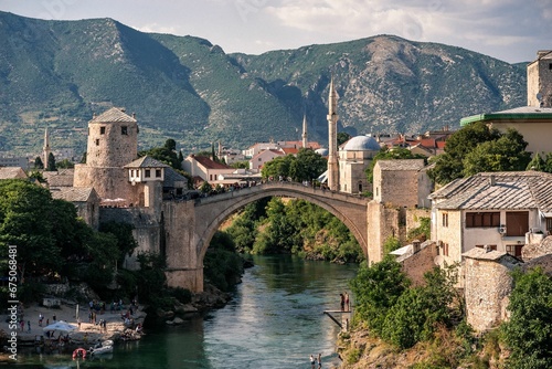 the village and bridge in mostar, bosnia has one bridge spanning a mountain range