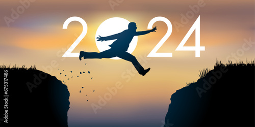 Un homme saute par dessus un gouffre entre deux falaises devant un soleil au zénith et symbolise le passage à la nouvelle année 2024.