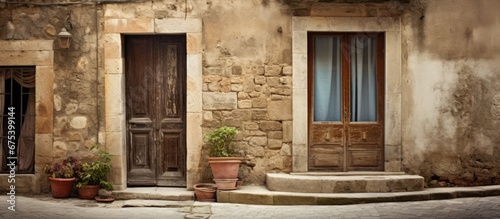 In Italy the old stone house with its vintage windows and door showcases a beautiful blend of retro design and architectural charm standing tall on a picturesque street capturing the essence