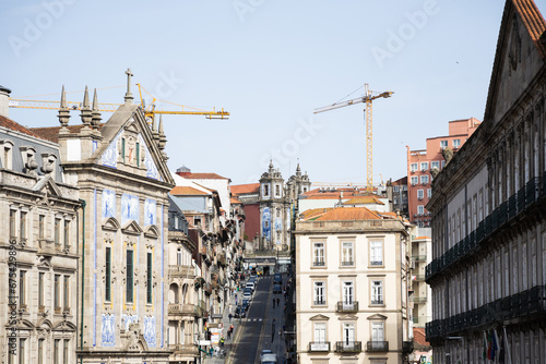 Steep hill road in Porto with blue buildings 