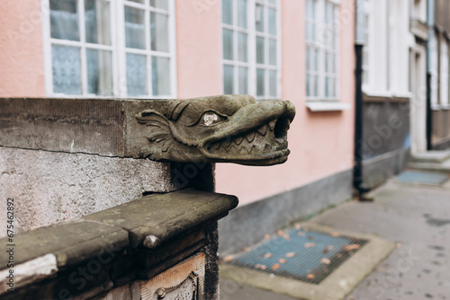 Head of dragon as decoration on old street in Gdansk, Poland