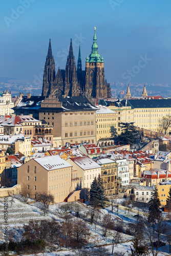 Snowy Prague City with gothic Castle in the sunny Day from the Hill Petrin, Czech republic