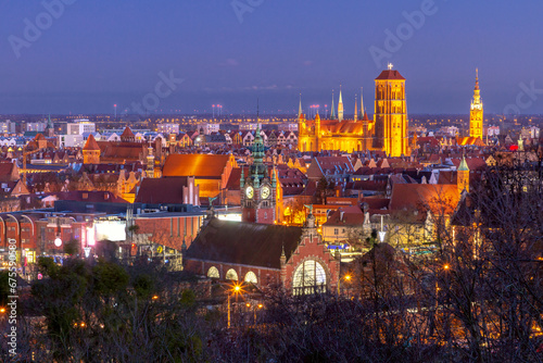 Aerial view of the Saint Mary Church and City Hall at night in Gdansk, Poland