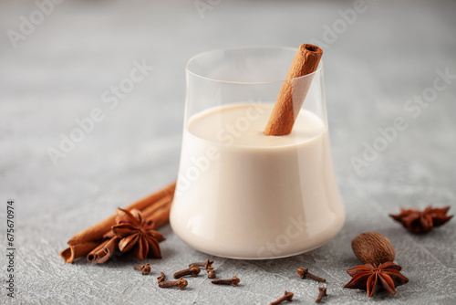 Traditional Christmas milk cocktail - Eggnog with cinnamon