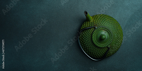 Traditional Japanese teapot for brewing tea. On a black stone background. Top view. Free space for text.