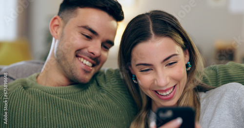Happy, phone and couple on sofa for social media, internet and reading funny website together. Dating, home and man and woman on smartphone laugh for meme and bonding, relax and love in living room