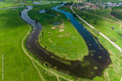 The bend of the oxbow lake Ogublyanka from the air, green natural landscape