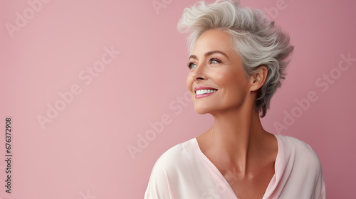 Confident elderly senior model with grey hair, mature happy smiling female lady in colorful close-up portrait