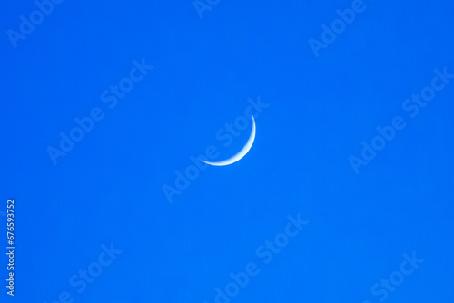 New moon isolated on deep blue sky background