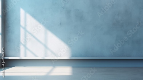 Abstract light gray blue background, perfect for product presentations. Shadows and light from the window on the cement wall Morning light enters through the diagonal window.