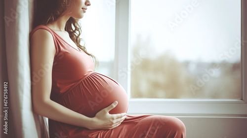 woman looking at her belly