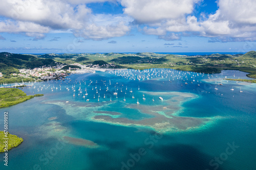 Yachts dotting Martinique's azure bay Vibrant Caribbean harbor from above