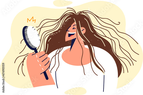 Shaggy woman is holding comb and laughing, seeing electrified hair sticking out in directions