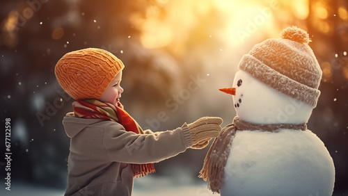 A smiling child having a happy time with a snowman outdoors on a warm winter day
