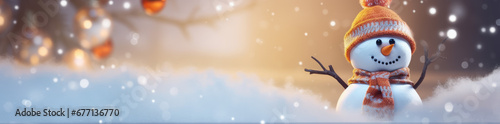 Winter holiday christmas background banner - Closeup of cute funny laughing snowman with wool hat and scarf, on snowy snow snowscape with bokeh lights, illuminated by the sun