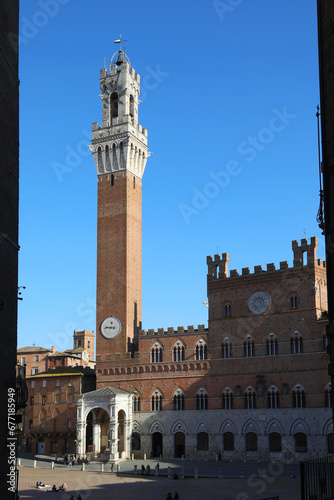 Siena Italy Tower called TORRE DEL MANGIA and the Cappella a marble tabernacle at the foot of the tower