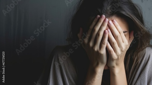 Exhausted mother covering her face in distress With copyspace for text 
