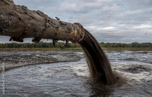 Refining pipe flowing into the river.