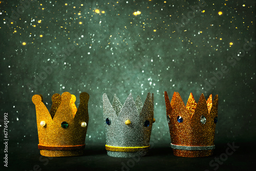 Three crowns of the three wise men and christmas lights. Concept for Reyes Magos day. Three Wise Men concept