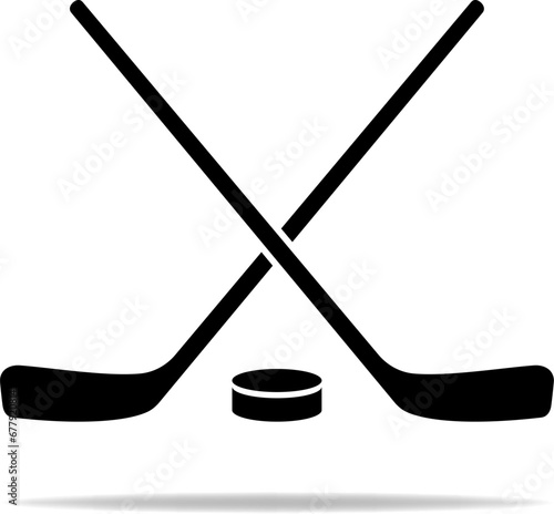 Black hockey icon. Hockey sticks with puck sign for sport design. vector .