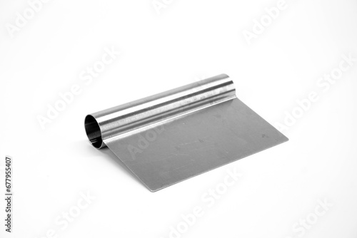 Stainless steel cutter isolated on white background. Stainless steel dough scraper