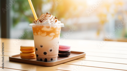 Bubble milk tea in a clear plastic cup on a wood table