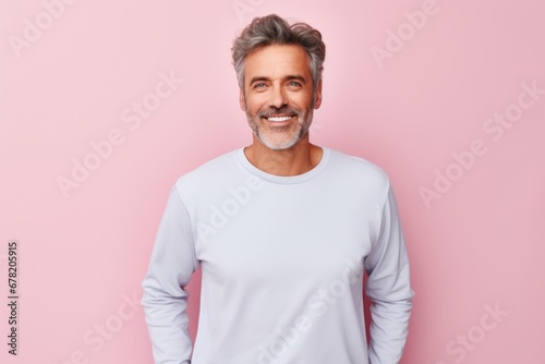 Portrait of a happy man in his 50s sporting a long-sleeved thermal undershirt against a pastel or soft colors background. AI Generation