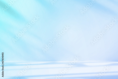 Abstract blue color gradient studio background for product presentation. Empty room with shadows of window and flowers and palm leaves . 3d room with copy space. Summer concert. Blurred backdrop.