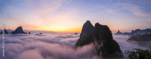 Sunrise time over the Karst mountain natural landscape from Xianggong Mountain, with rolling clouds around, Guilin, Guangxi, China.