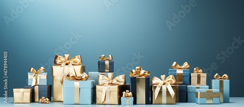 blue gift boxes with golden bows on blue background