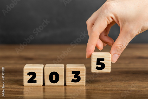 2035 on Wooden Block. Merry Christmas and Happy New Year, 2035 new year idea concept. Going in toward 2035