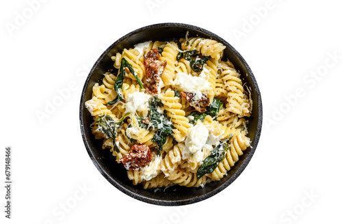Delicious pasta fusilli dish with creamy spinach sauce and dried tomatoes. Transparent background. Isolated.