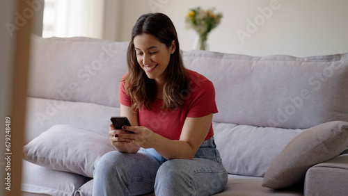 Woman using smartphone. Happy caucasian female enjoy online chat, internet purchase, browse web, download new cool freeware application. Modern wireless tech user concept 