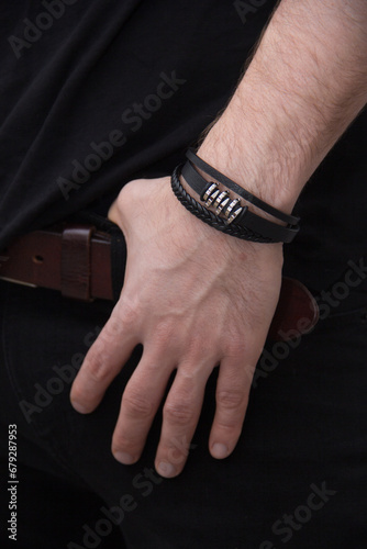 A leather bracelet on a man's hand. Men's accessories