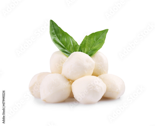 Tasty mozzarella balls and basil leaves isolated on white