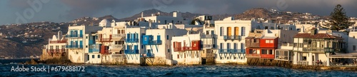 Panoramic view of Little Venice Mykonos (Chora), Cyclades Islands, Aegean Sea, Greece. Wterfront with rows of fishing houses line the waterfront with their balconies hanging over the sea.
