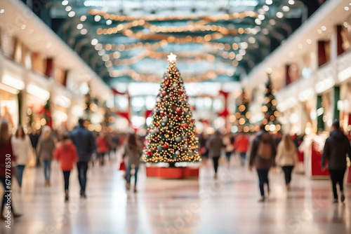 Shopping mall with stores, Christmas tree with decoration and crowd of people looking for present gifts.