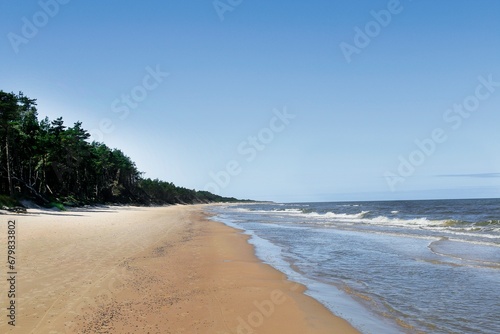 The coast of the Baltic Sea near Leba destination and Slovenian National Park with the largest sand dunes in Europe.