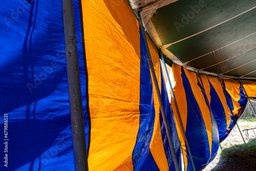 abstract images of a tarveling circus tent in blue and yellow colors. Brazil