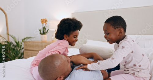 Bedroom, play and black family father, happy kids or people bonding, love and daughter tickle papa. Home wellness, happiness and African children, dad and parent smile, comfort and fun games on bed